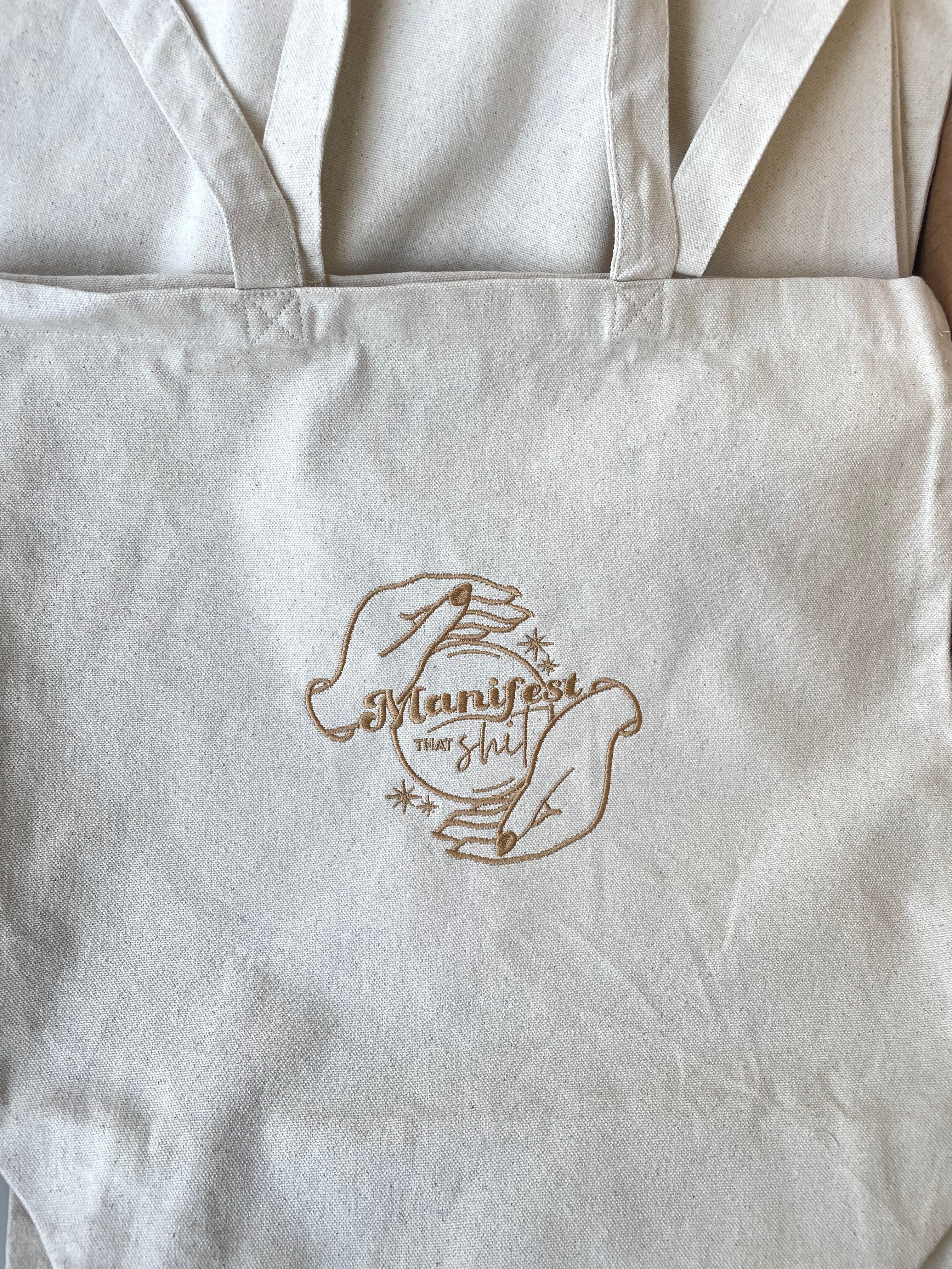 Manifest that shit tote bag